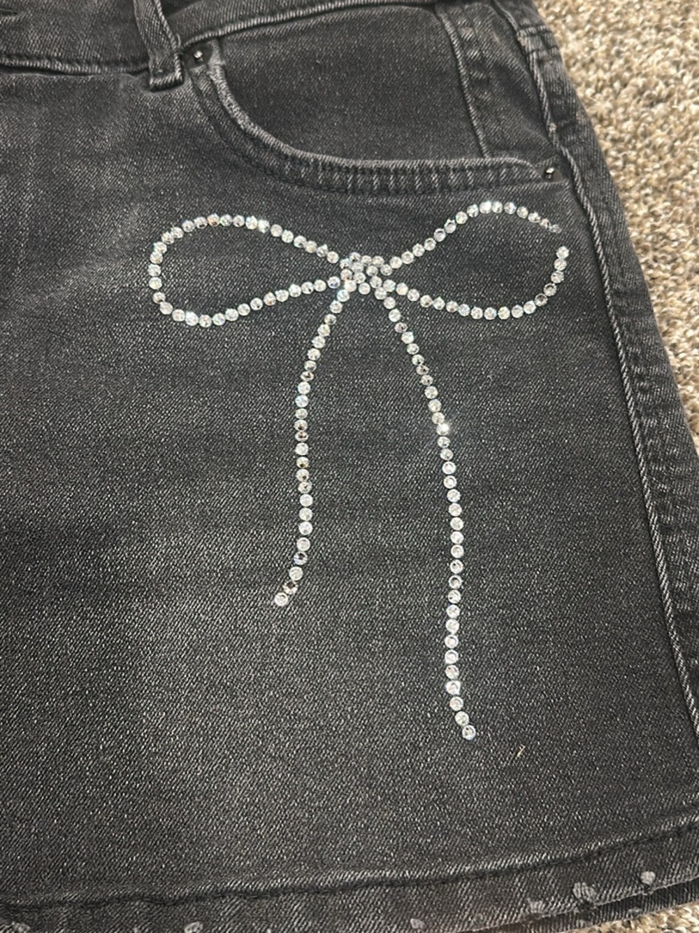 Black Women's Denim Mini Skirt with Crystal Bow Detail - Picture 2 of 4